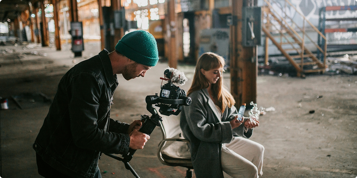 Documentary filmmakers at work in an industrial setting